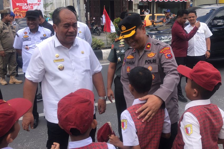 Polres Asahan Lakukan Pengamanan Pembagian 3.250 Bendera Merah Putih